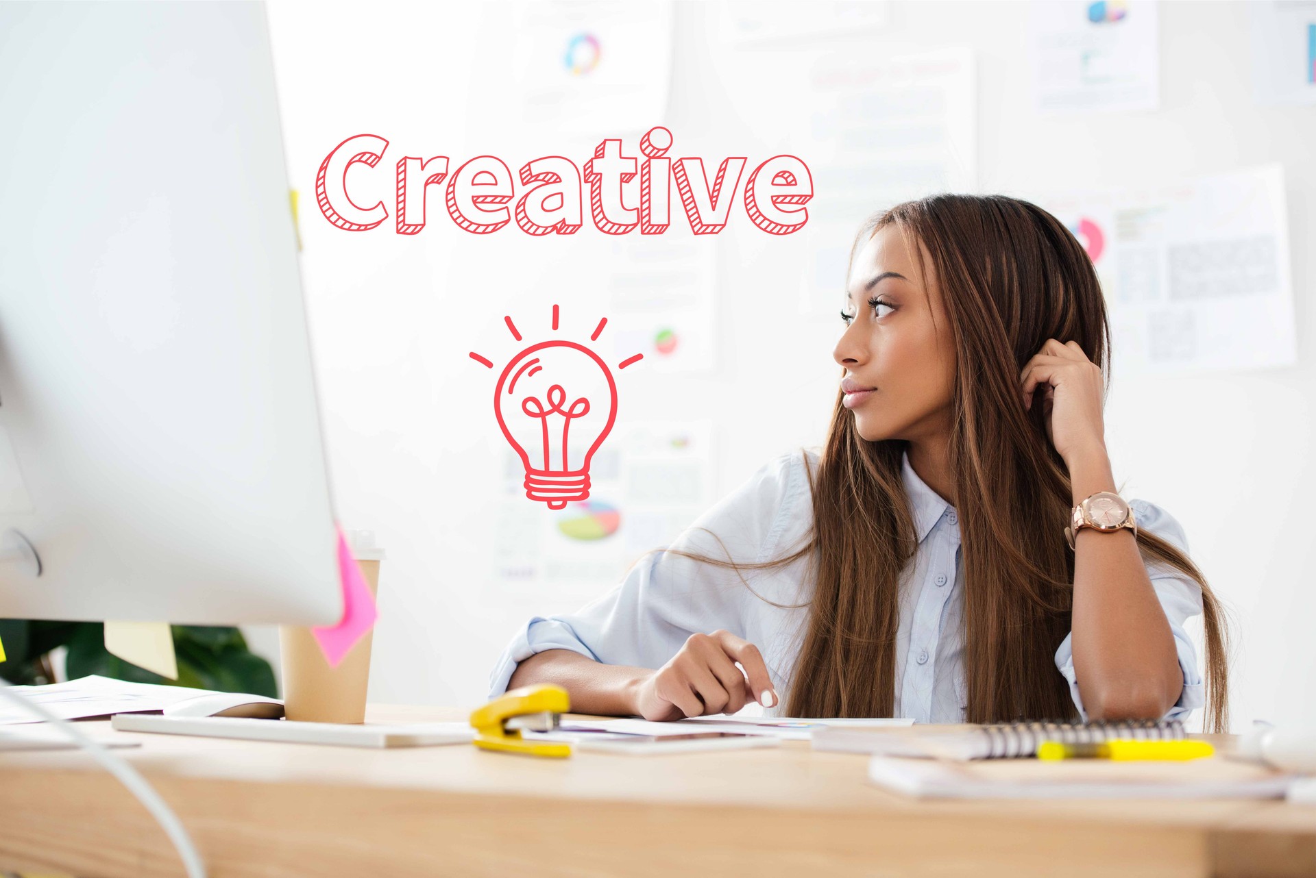 pensive african american businesswoman looking away at workplace in office, creative inscription and light bulb icon